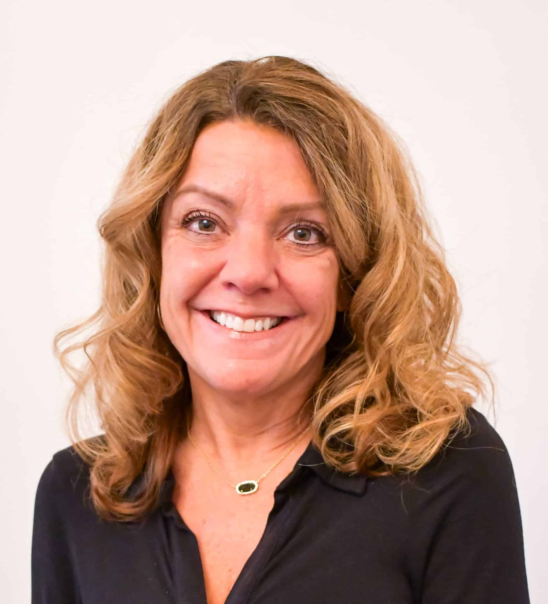 a woman smiling for the camera