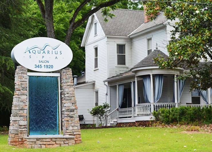 a sign in front of a house