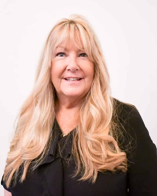 a woman smiling for the camera