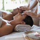 A Woman Sitting On A Bed