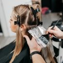 A Woman Holding A Guitar