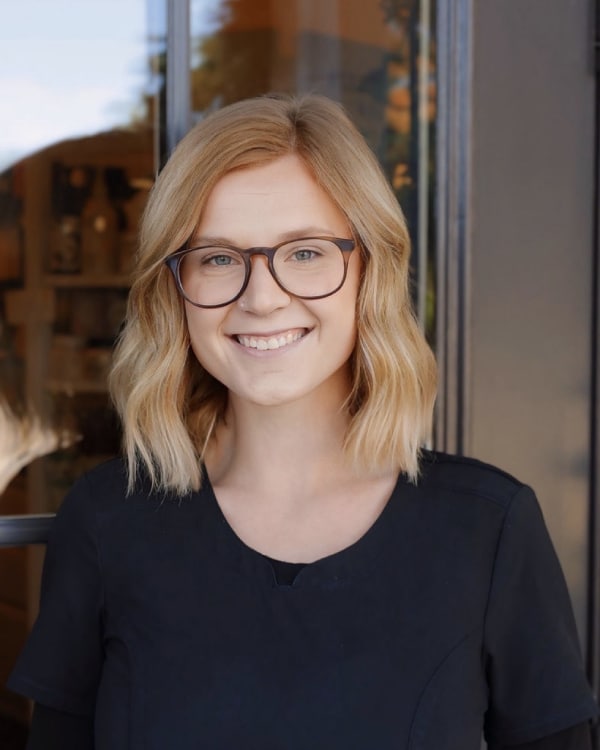 Mahalie Cameron in glasses looking at the camera